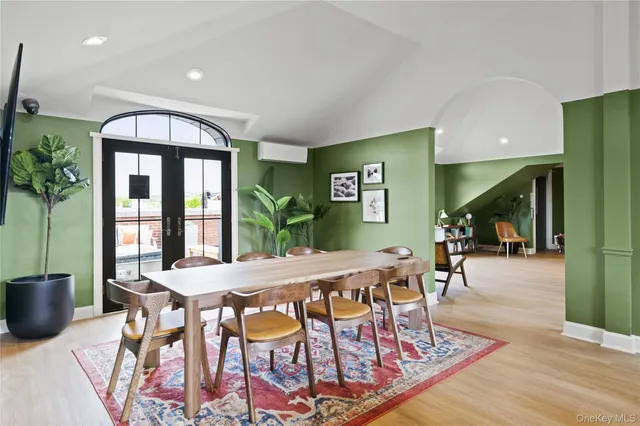 a living room with furniture a rug and a pool table