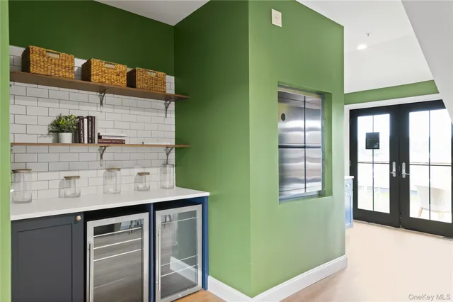 a view of a patio with table and chairs