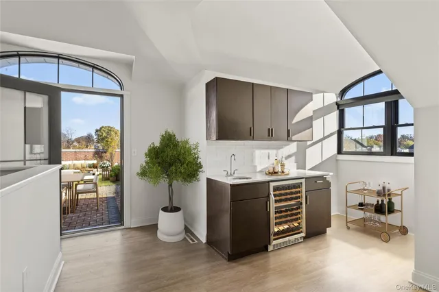 a kitchen with stainless steel appliances a stove and more cabinets