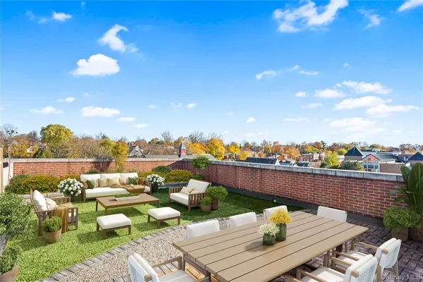 a view of a terrace with furniture