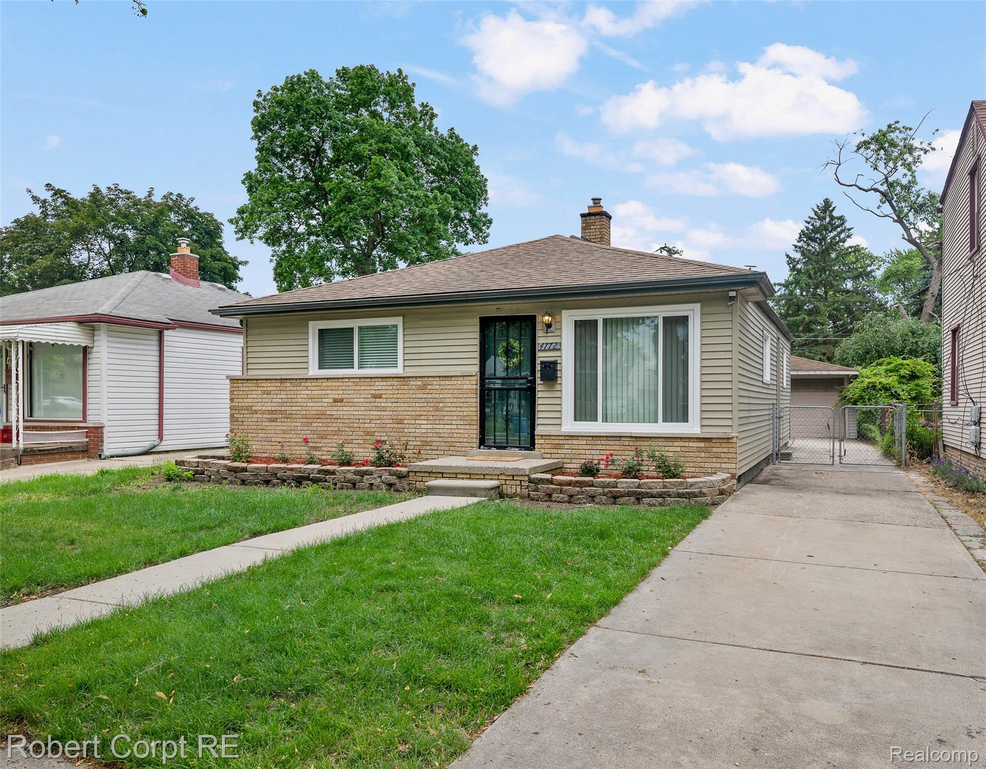 4772 Harding Street Dearborn Heights, MI 48125 - Photo 2 of 22 View of front of home featuring brick siding, a gate, and a chimney
