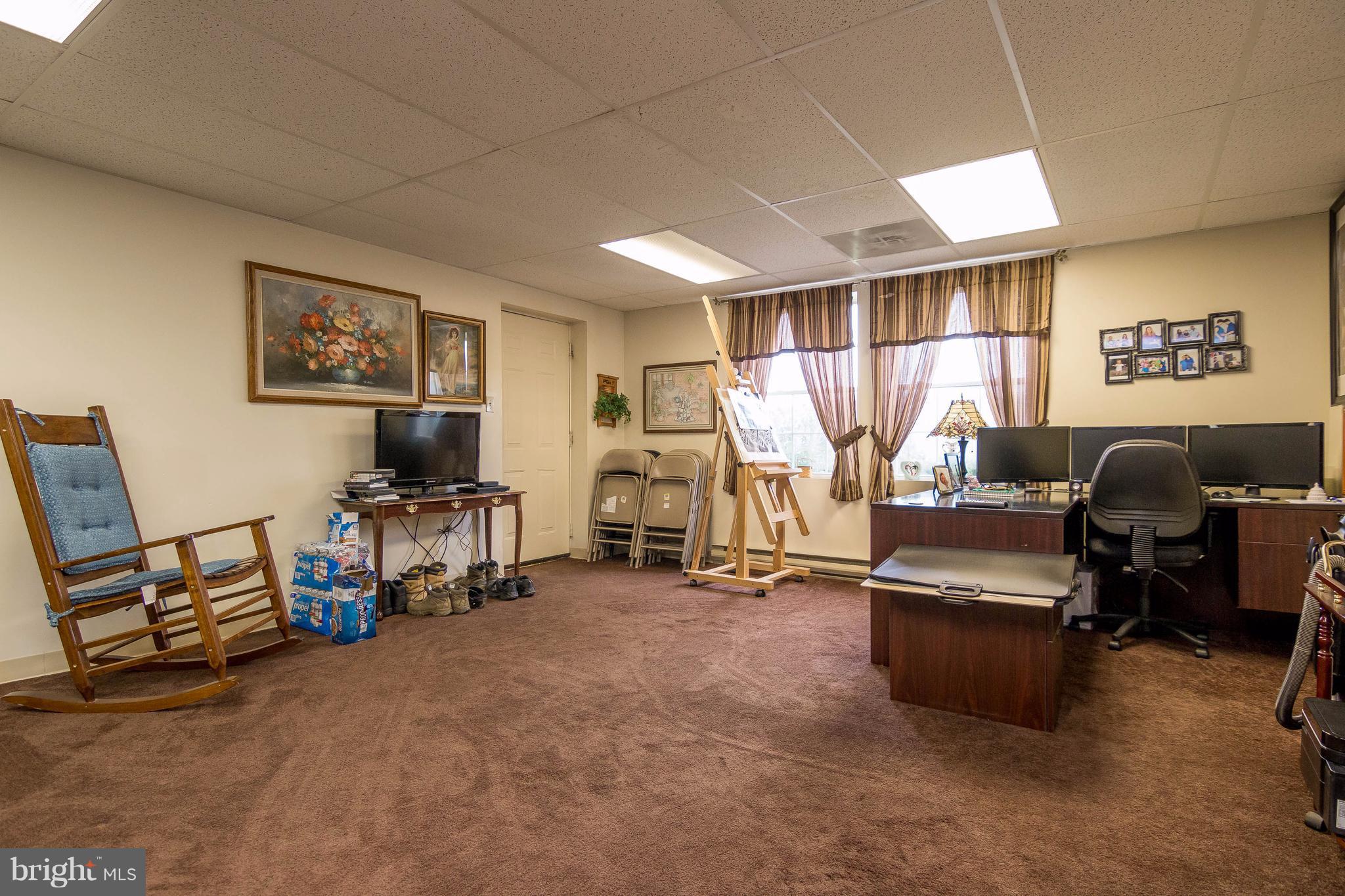 4009 Bill Moxley Road Mount Airy, MD 21771 - Photo 14 of 22 a view of a livingroom with furniture and a flat screen tv
