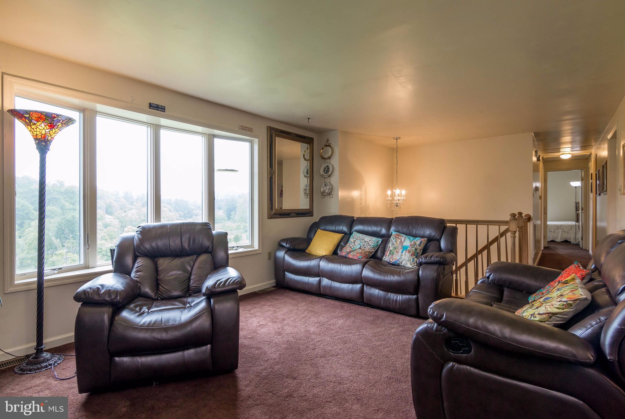 4009 Bill Moxley Road Mount Airy, MD 21771 - Photo 3 of 22 a living room with furniture and a large window