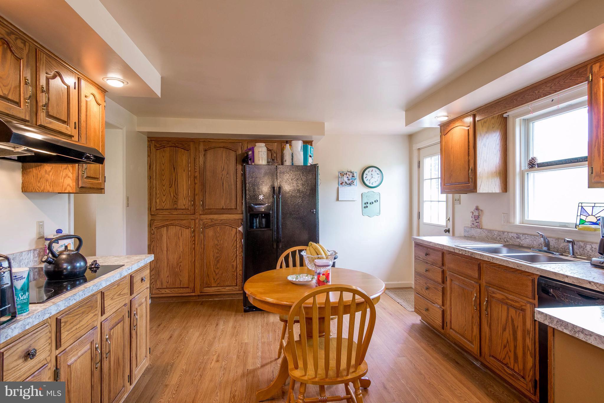 4009 Bill Moxley Road Mount Airy, MD 21771 - Photo 6 of 22 a kitchen with stainless steel appliances granite countertop a refrigerator and a stove top oven