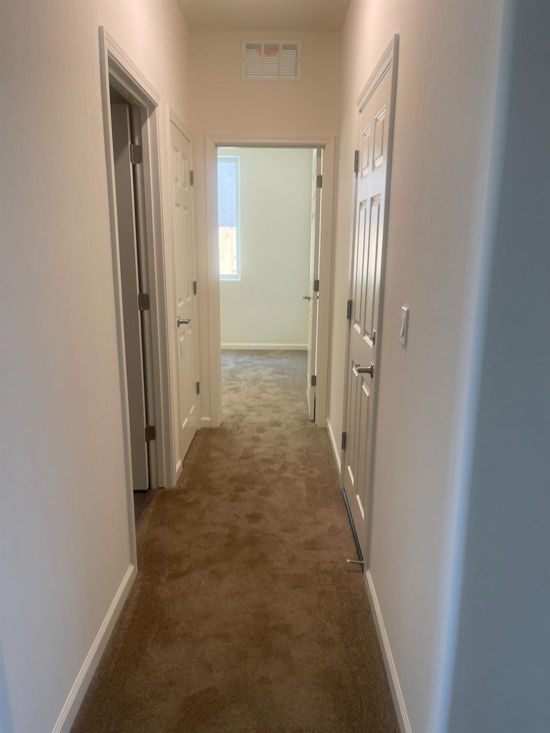 13320 4th Street, Unit LOT1 Parlier, CA 93648 - Photo 5 of 12 a view of a hallway with wooden floor