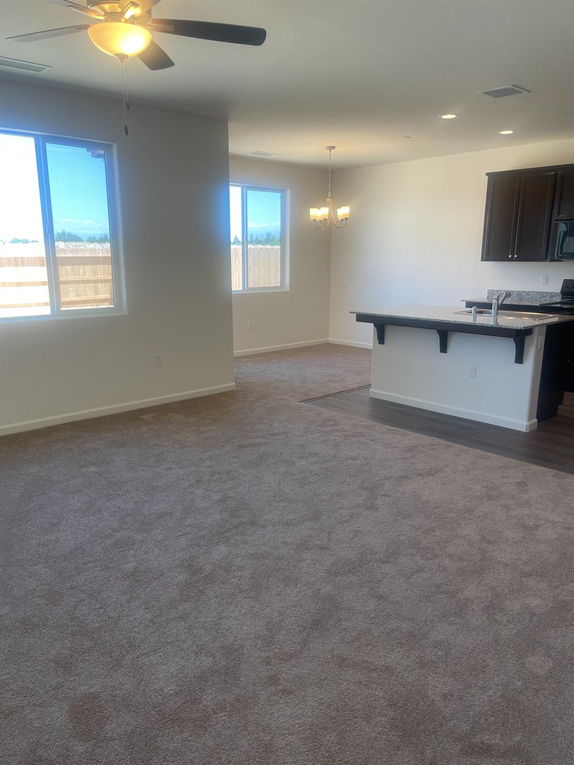13320 4th Street, Unit LOT1 Parlier, CA 93648 - Photo 8 of 12 a view of an empty room with a window and fireplace