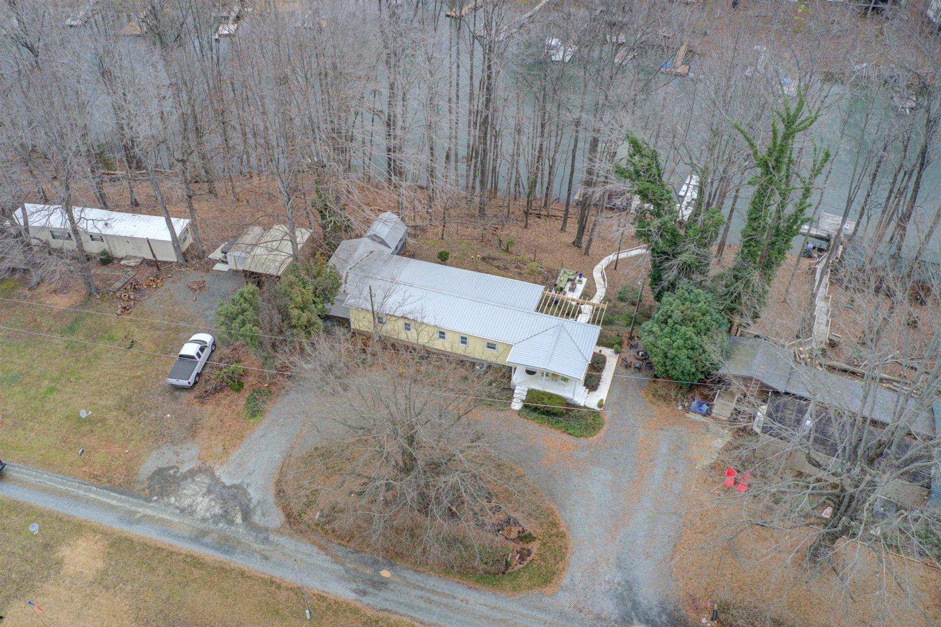 232 Munsons Road Penhook, VA 24137 - Photo 1 of 50 a backyard of a house with lots of green space