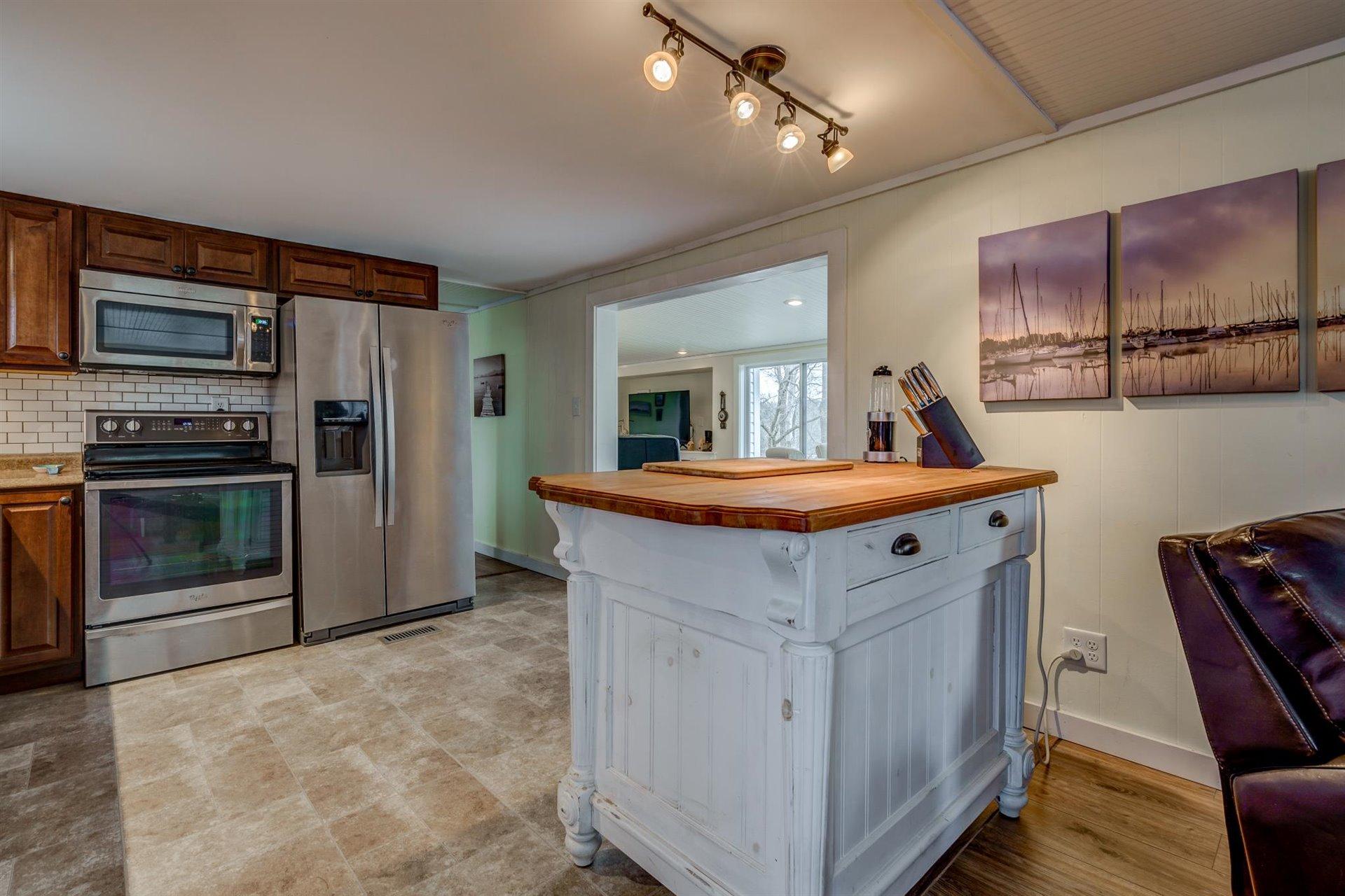 232 Munsons Road Penhook, VA 24137 - Photo 15 of 50 a kitchen with a stove refrigerator and a sink