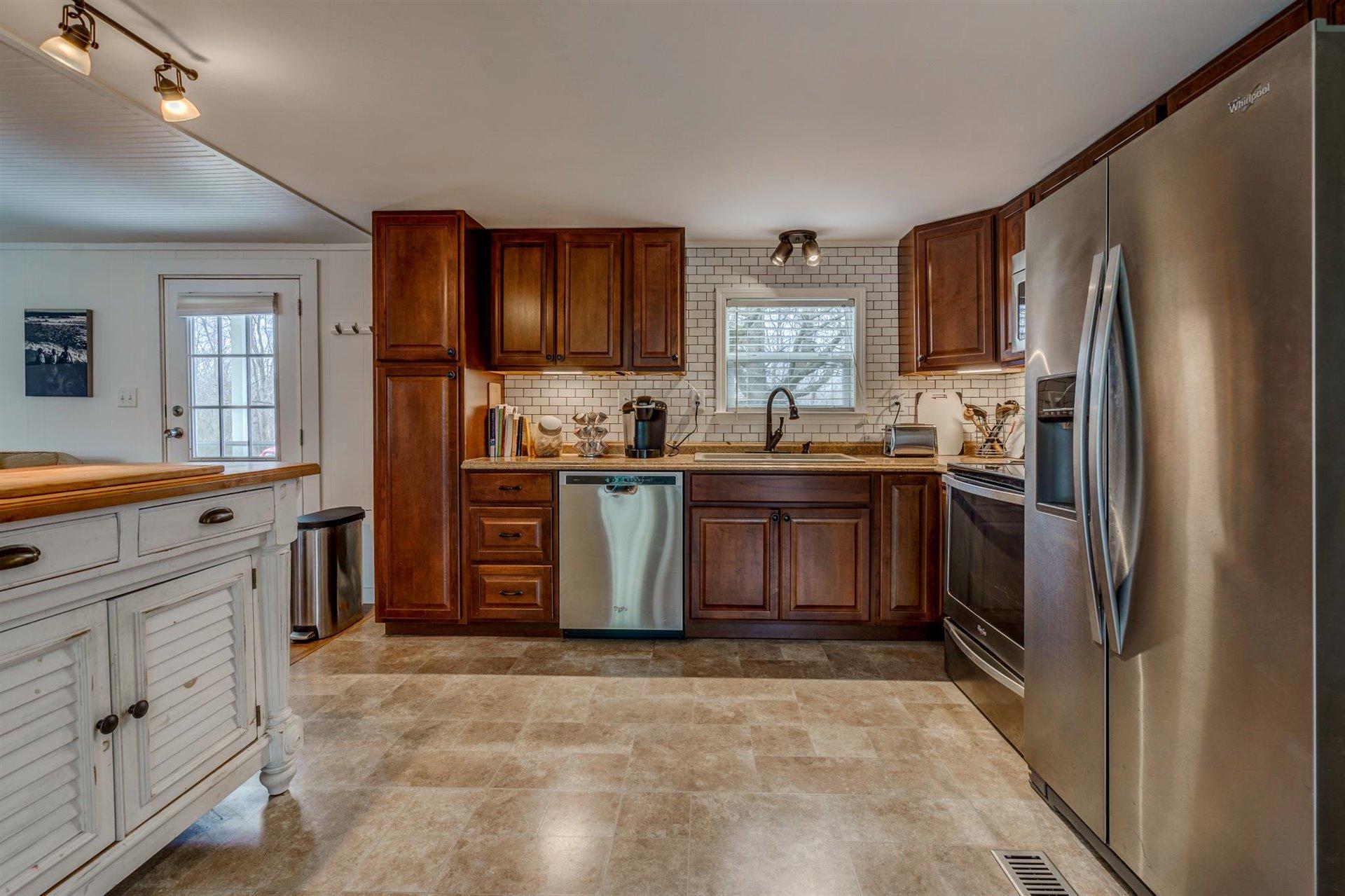 232 Munsons Road Penhook, VA 24137 - Photo 16 of 50 a kitchen with stainless steel appliances granite countertop a stove a sink dishwasher a refrigerator and a oven