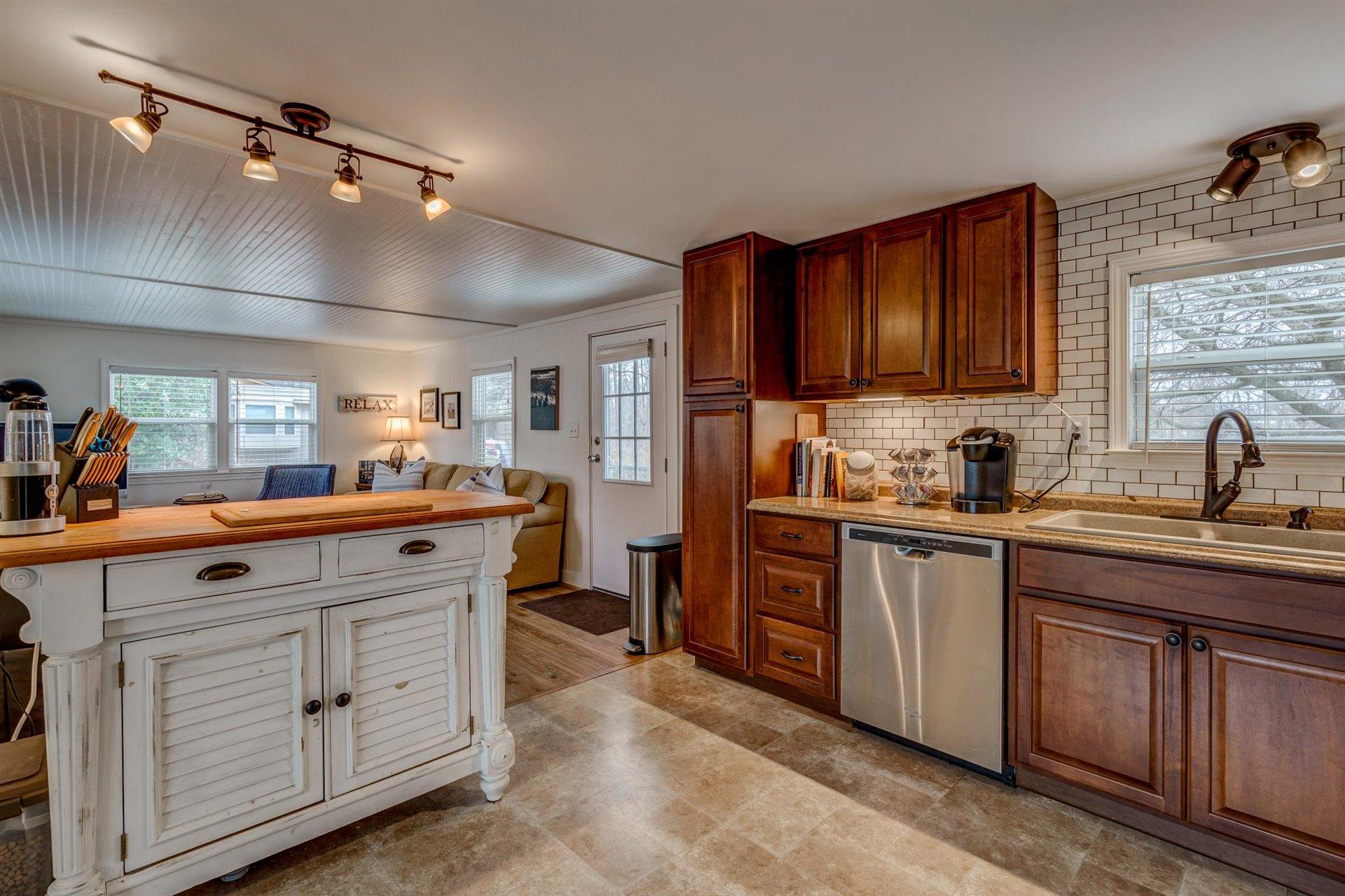 232 Munsons Road Penhook, VA 24137 - Photo 17 of 50 a kitchen with white cabinets