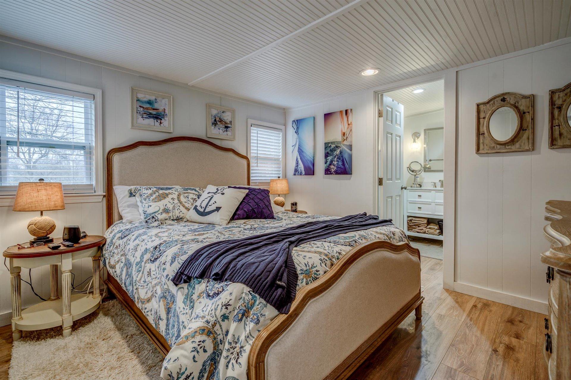 232 Munsons Road Penhook, VA 24137 - Photo 28 of 50 a bedroom with bed and wooden floor