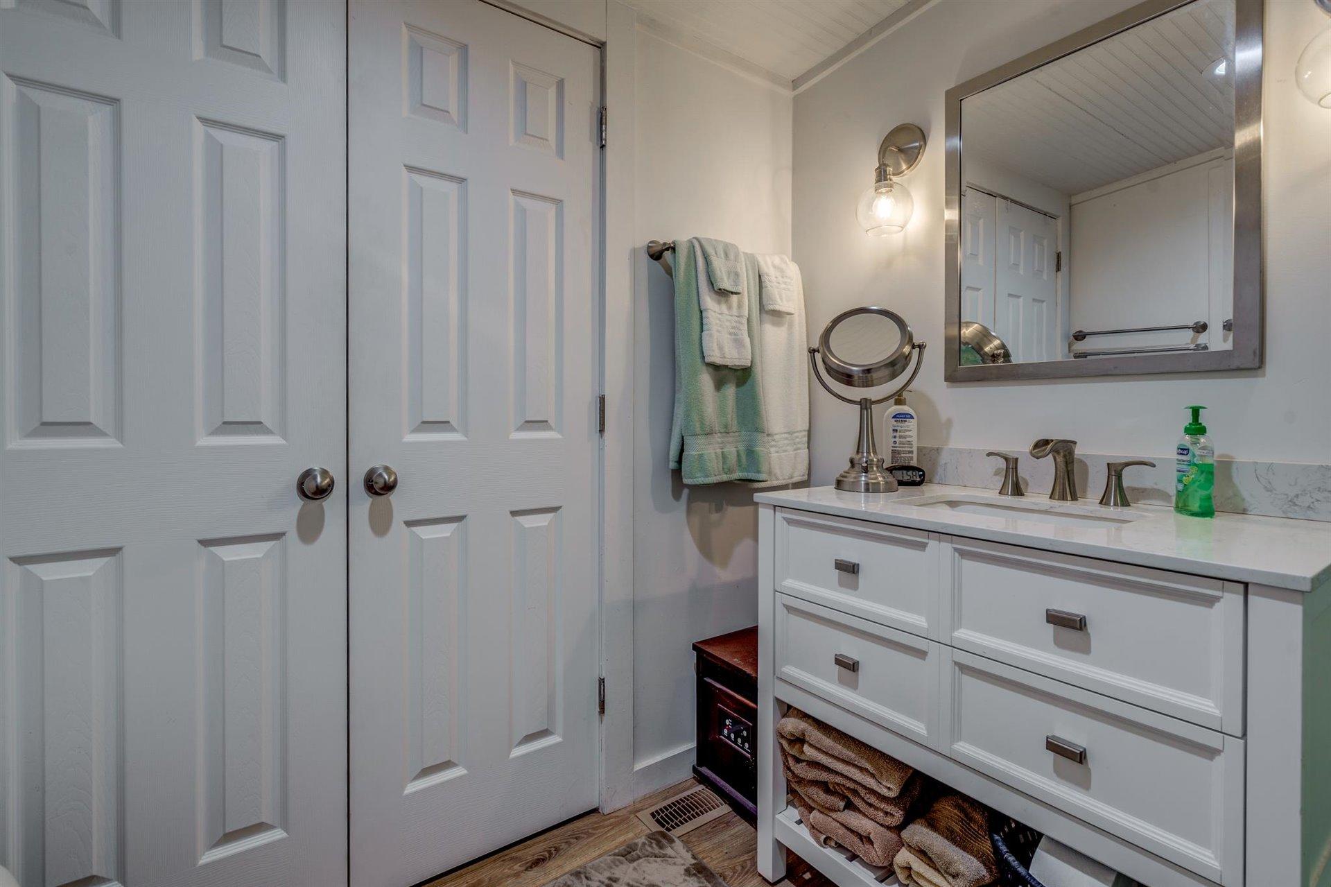 232 Munsons Road Penhook, VA 24137 - Photo 31 of 50 a view of cabinets with mirror on the wall