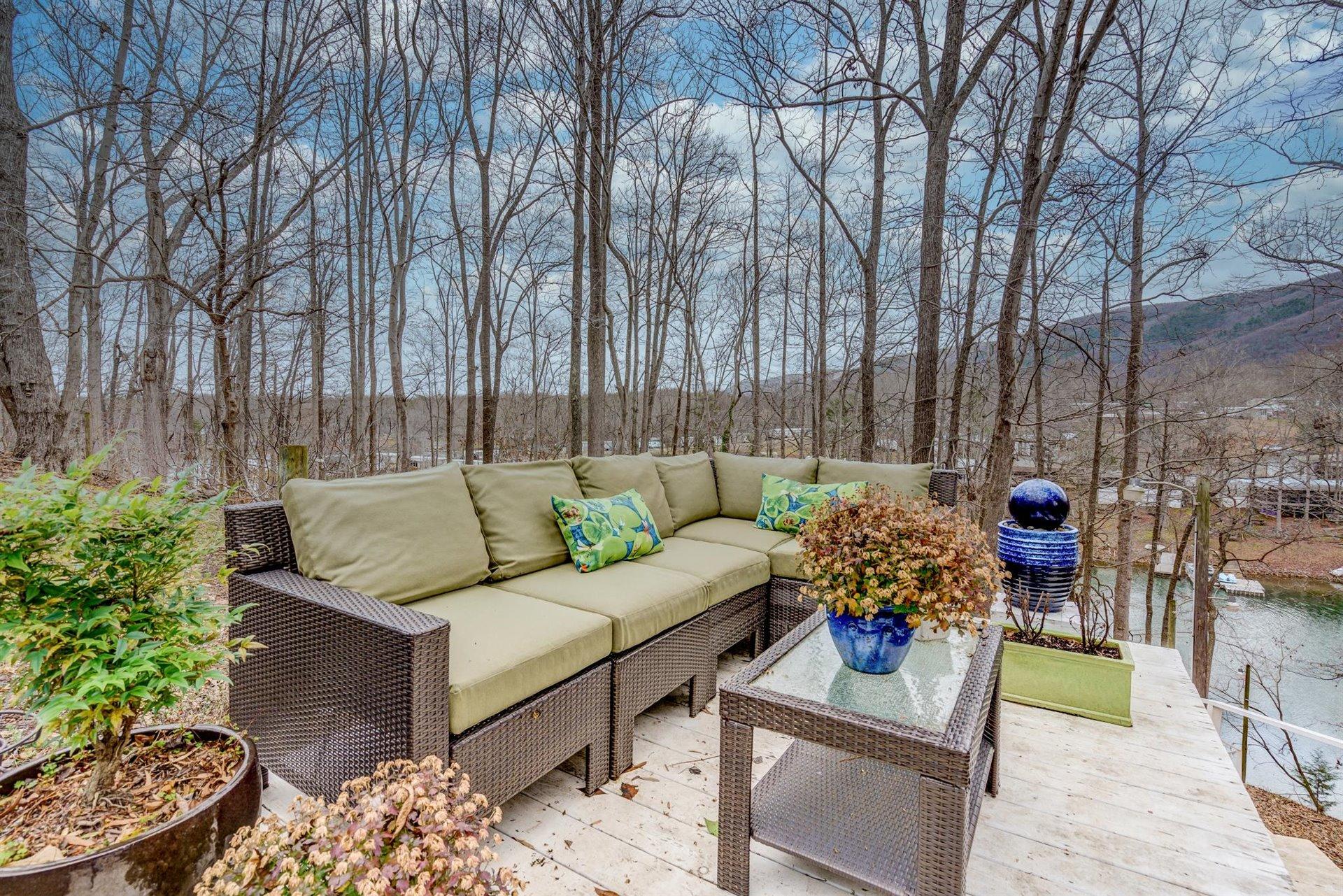 232 Munsons Road Penhook, VA 24137 - Photo 36 of 50 a outdoor living space with furniture and a potted plant