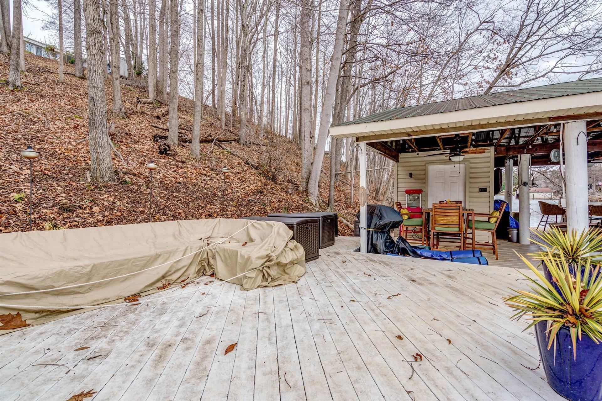 232 Munsons Road Penhook, VA 24137 - Photo 40 of 50 a bed room with a bed and a couch