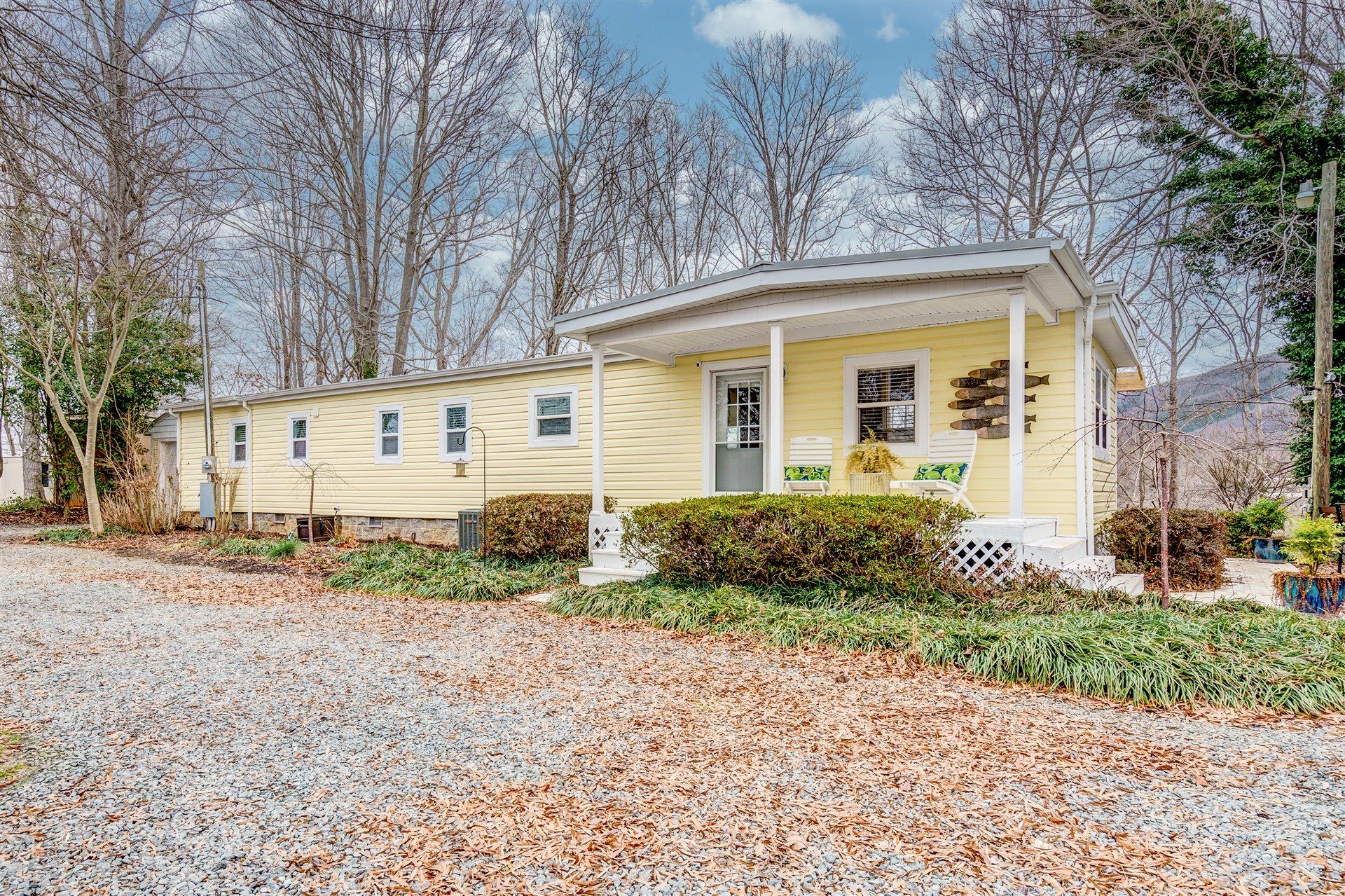 232 Munsons Road Penhook, VA 24137 - Photo 5 of 50 a front view of a house with garden