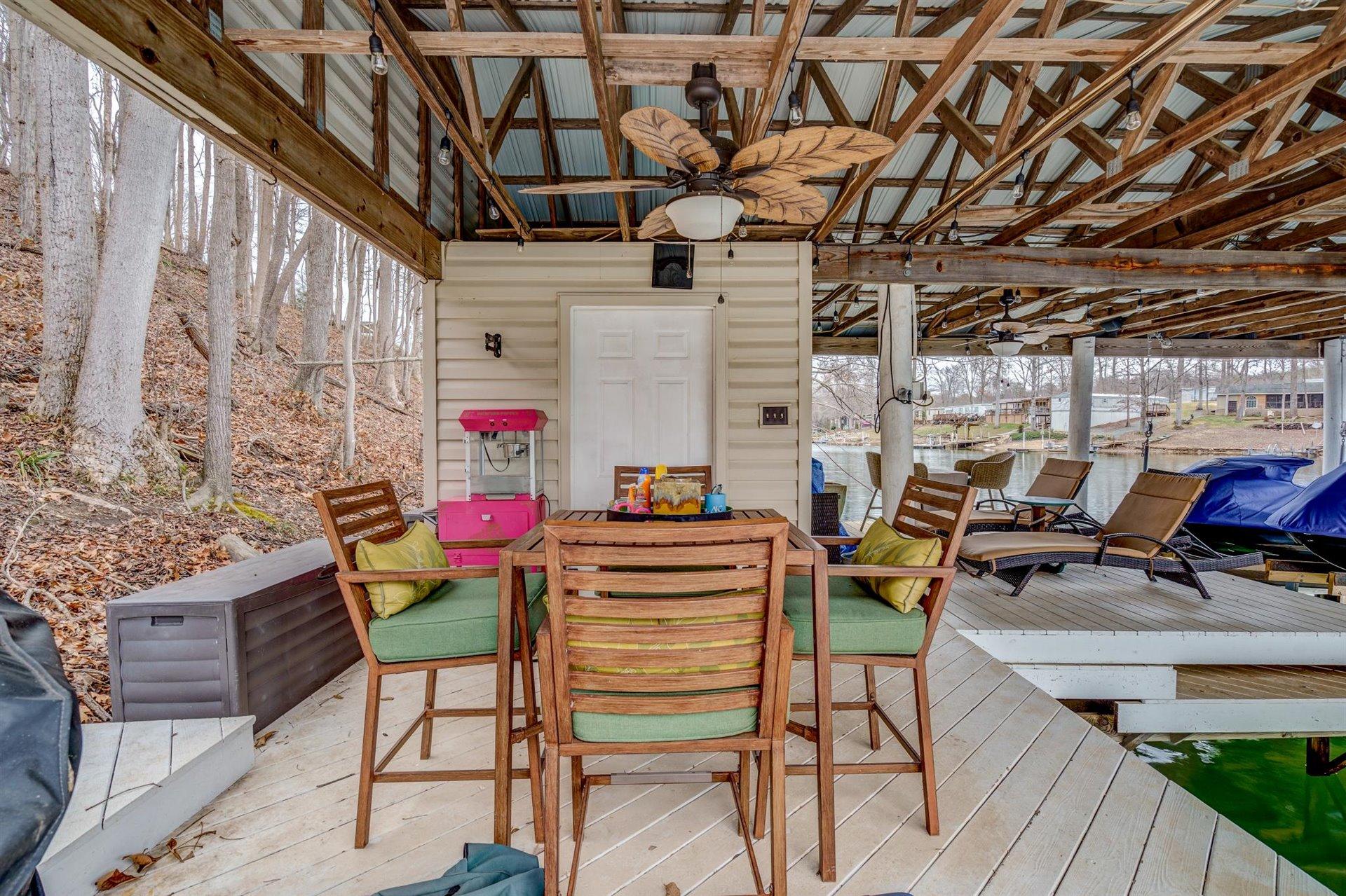232 Munsons Road Penhook, VA 24137 - Photo 41 of 50 a view of a chairs and table in a patio