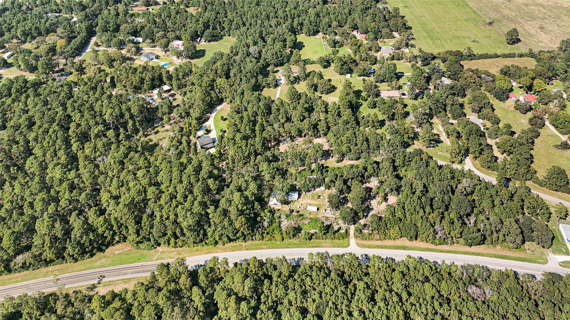 157 Jim Browder Road Willis, TX 77378 - Photo 15 of 17 a view of a yard with plants and wooden fence
