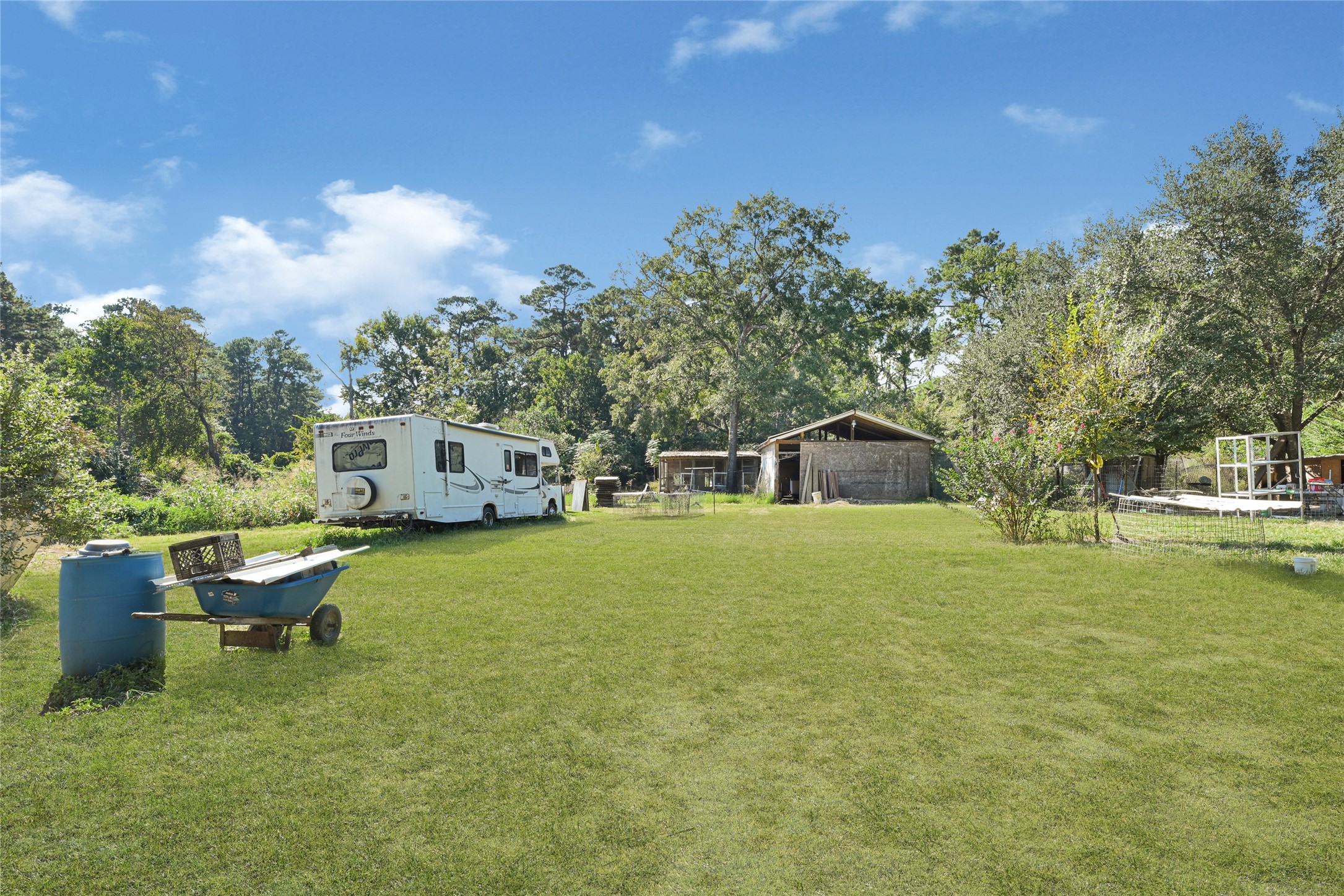 157 Jim Browder Road Willis, TX 77378 - Photo 2 of 17 a front view of a house with a yard and trees