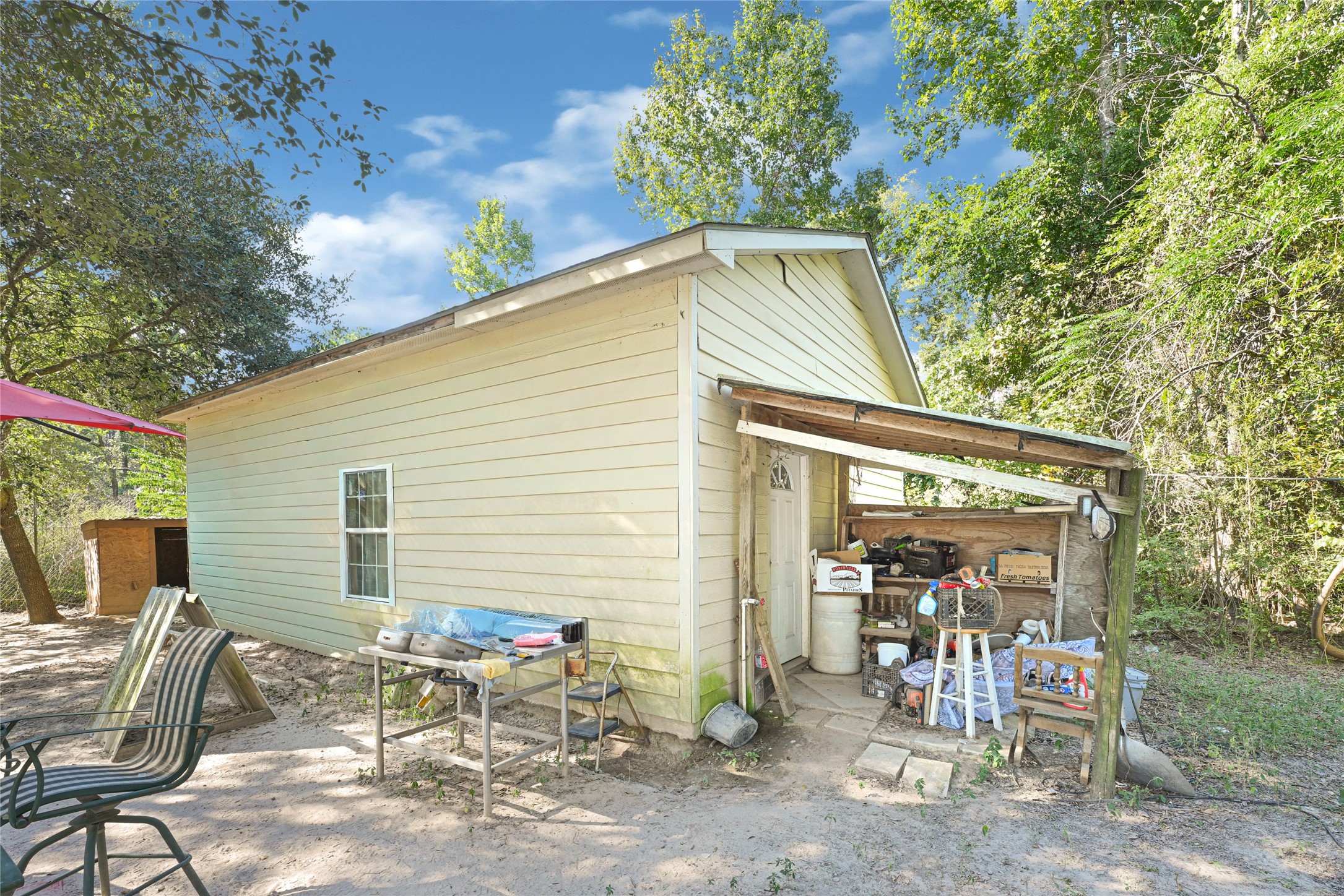 157 Jim Browder Road Willis, TX 77378 - Photo 6 of 17 a backyard of a house with table and chairs
