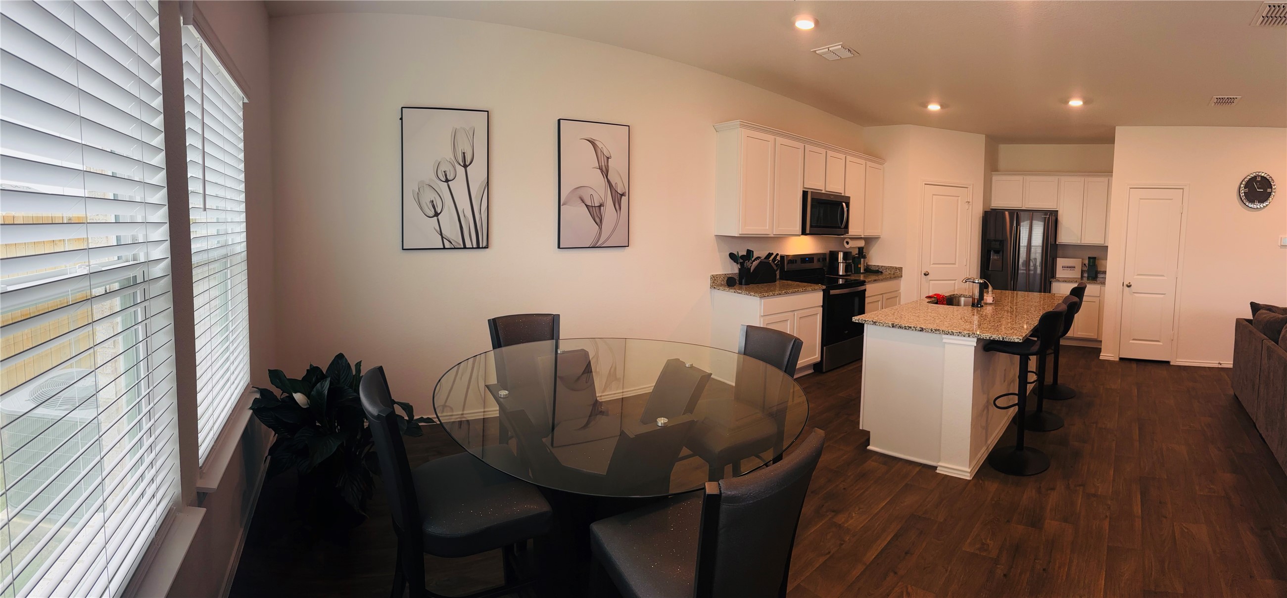 14817 Perlino Way, Unit A Manor, TX 78653 - Photo 5 of 40 a view of a dining room with furniture and wooden floor