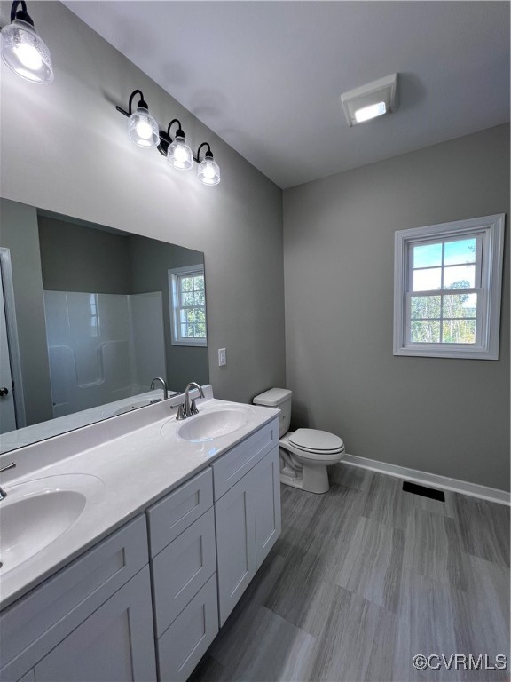 954 Monroe Church Road Rice, VA 23966 - Photo 8 of 12 a bathroom with a sink vanity granite and toilet