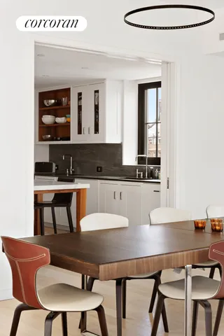 a living room with furniture and a mirror