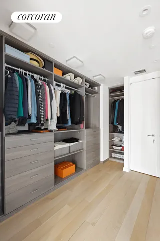 a spacious bedroom with a bed and a window