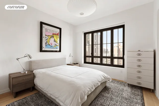 a en suite bathroom with a granite countertop sink and a mirror