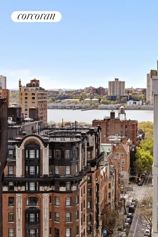 a roof deck with table and chairs