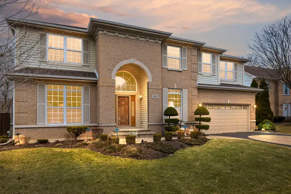a front view of a house with swimming pool and porch