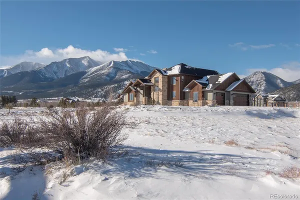 a view of a house with a snow in the yard