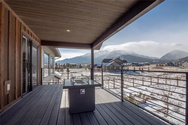 a view of a balcony with wooden floor