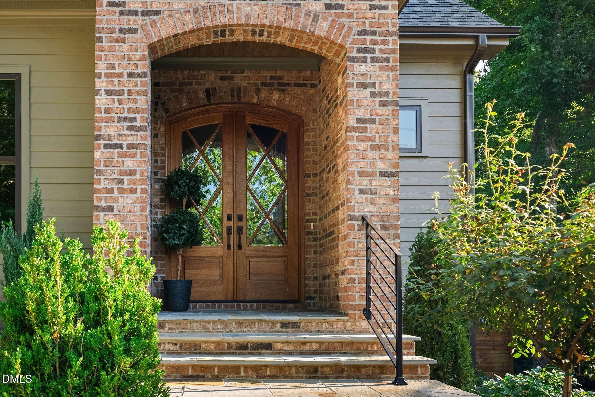 605 Ridgecrest Road Cary, NC 27511 - Photo 4 of 76 Stunning exterior, arched entry and tasteful landscaping