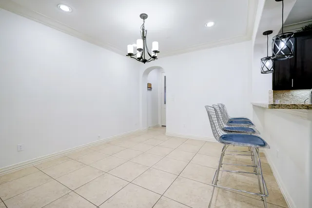 a view of kitchen with refrigerator and cabinets