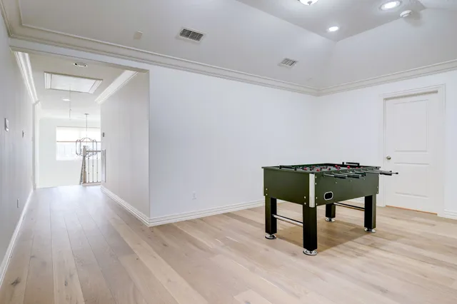 a work room with furniture and a wooden floor