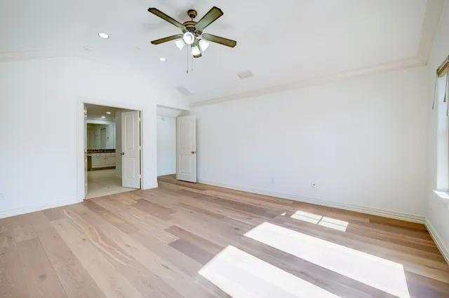 a large bathroom with a tub a sink shower and mirror