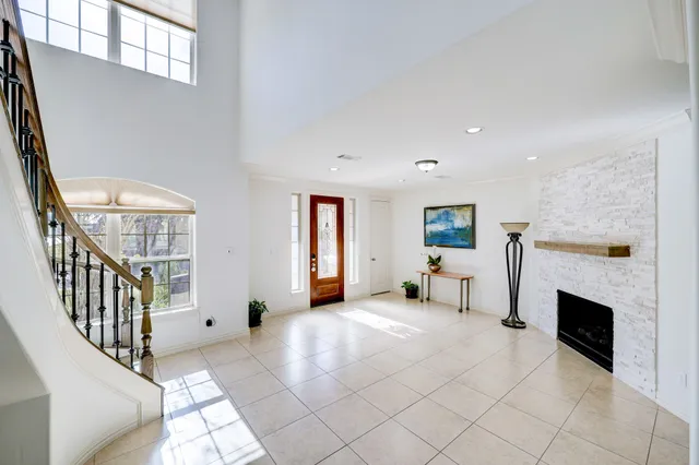 a view of entryway and hall with dining room