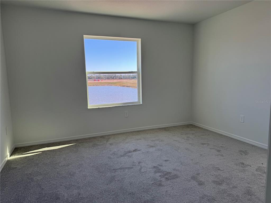 9026 Optimist Way Palmetto, FL 34221 - Photo 14 of 21 an empty room with a window