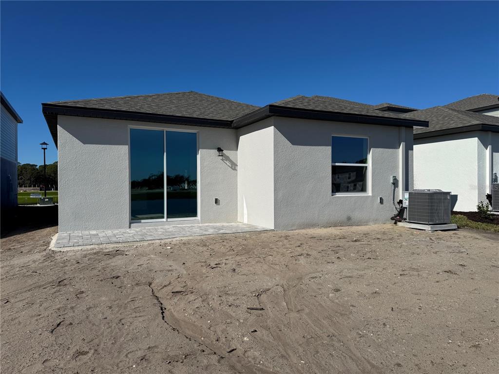 9026 Optimist Way Palmetto, FL 34221 - Photo 17 of 21 a view of a house with a patio