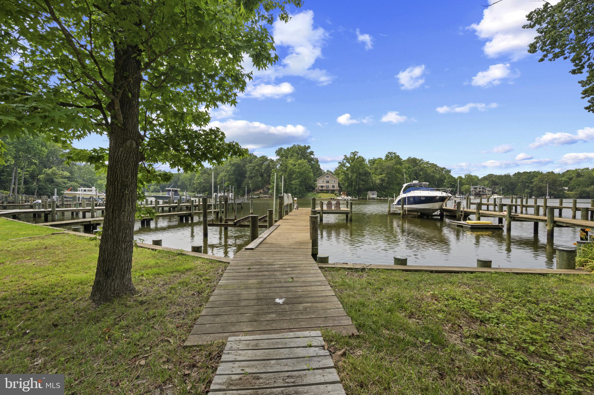 721 Magothy Road Arnold, MD 21012 - Photo 6 of 10 Pier w/water, electric and 10,000 lb. boat lift.