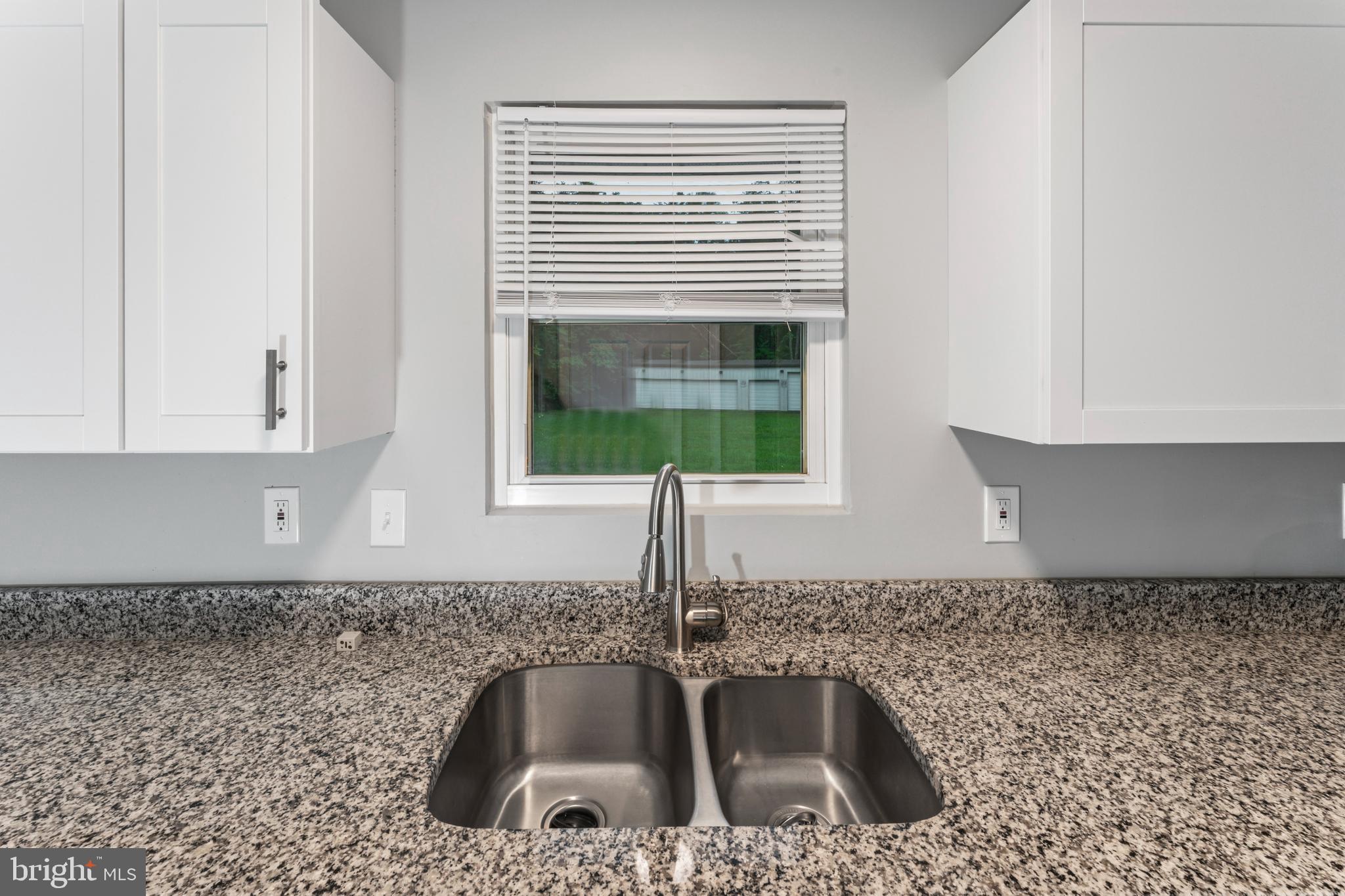 4 River Ridge Lane Fredericksburg, VA 22406 - Photo 13 of 43 a kitchen with granite countertop a sink and a window