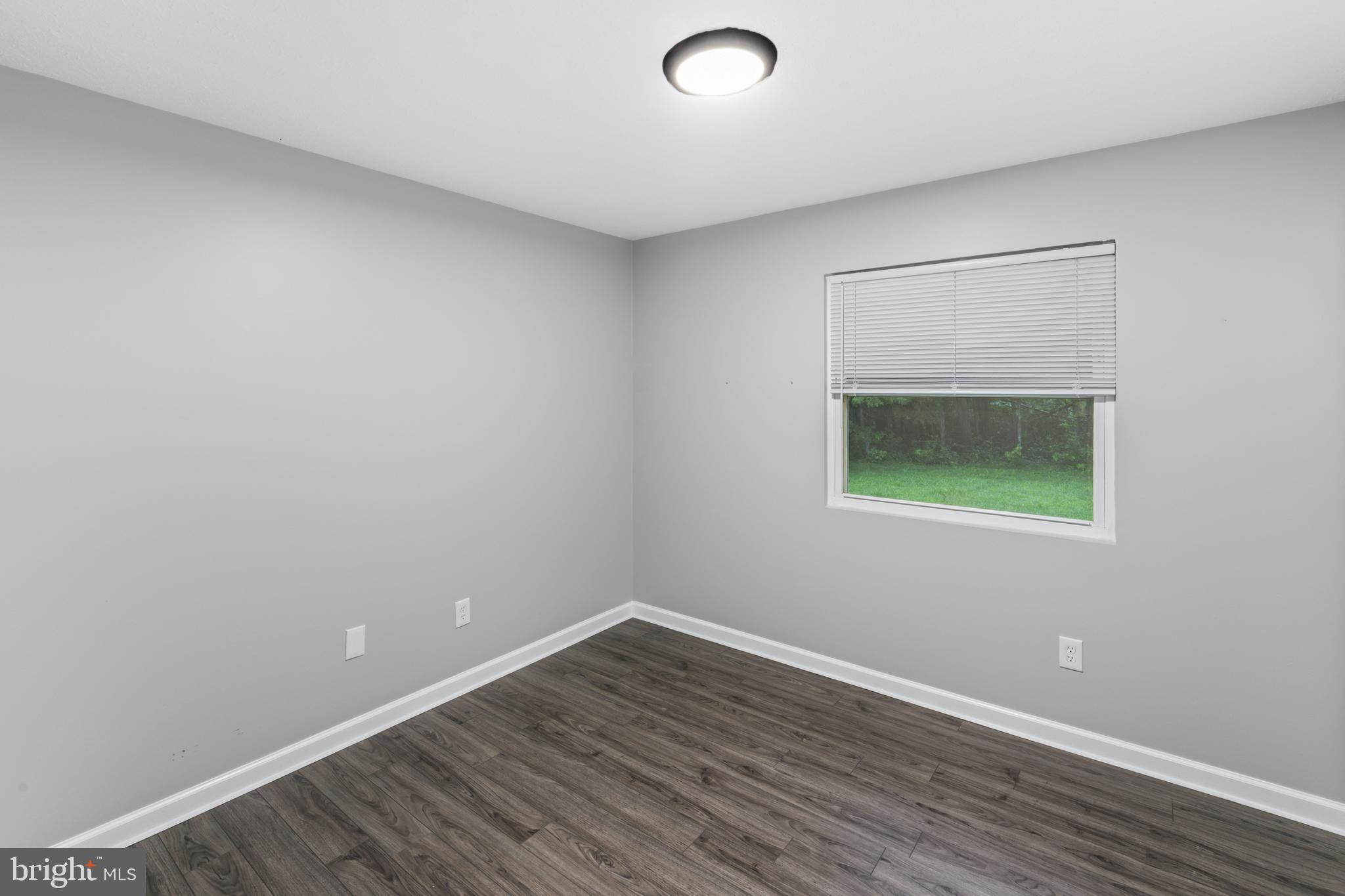 4 River Ridge Lane Fredericksburg, VA 22406 - Photo 20 of 43 an empty room with wooden floor and windows