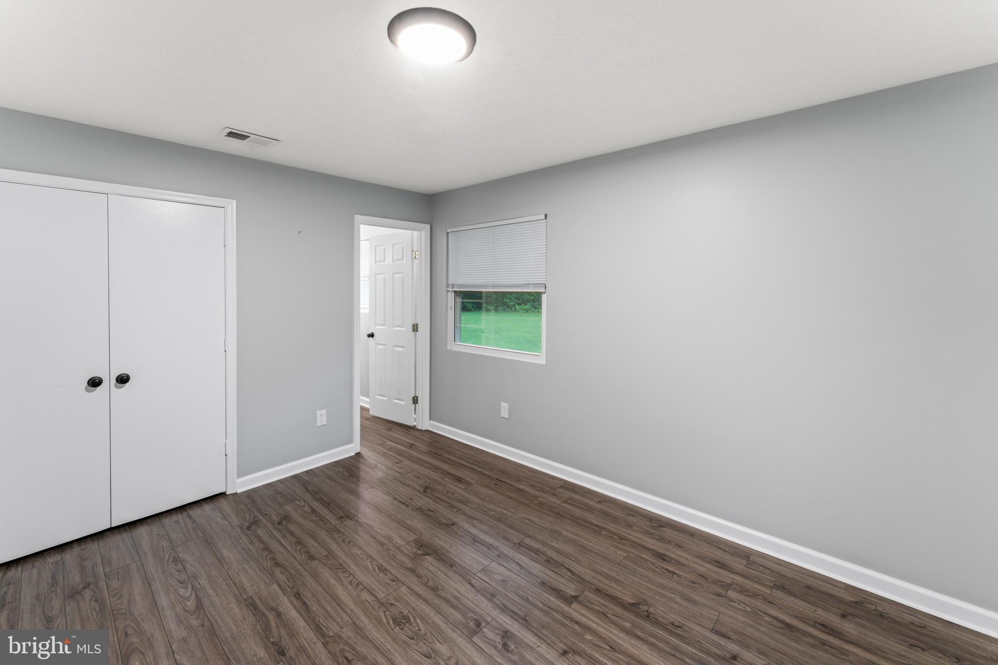 4 River Ridge Lane Fredericksburg, VA 22406 - Photo 25 of 43 a view of an empty room with wooden floor