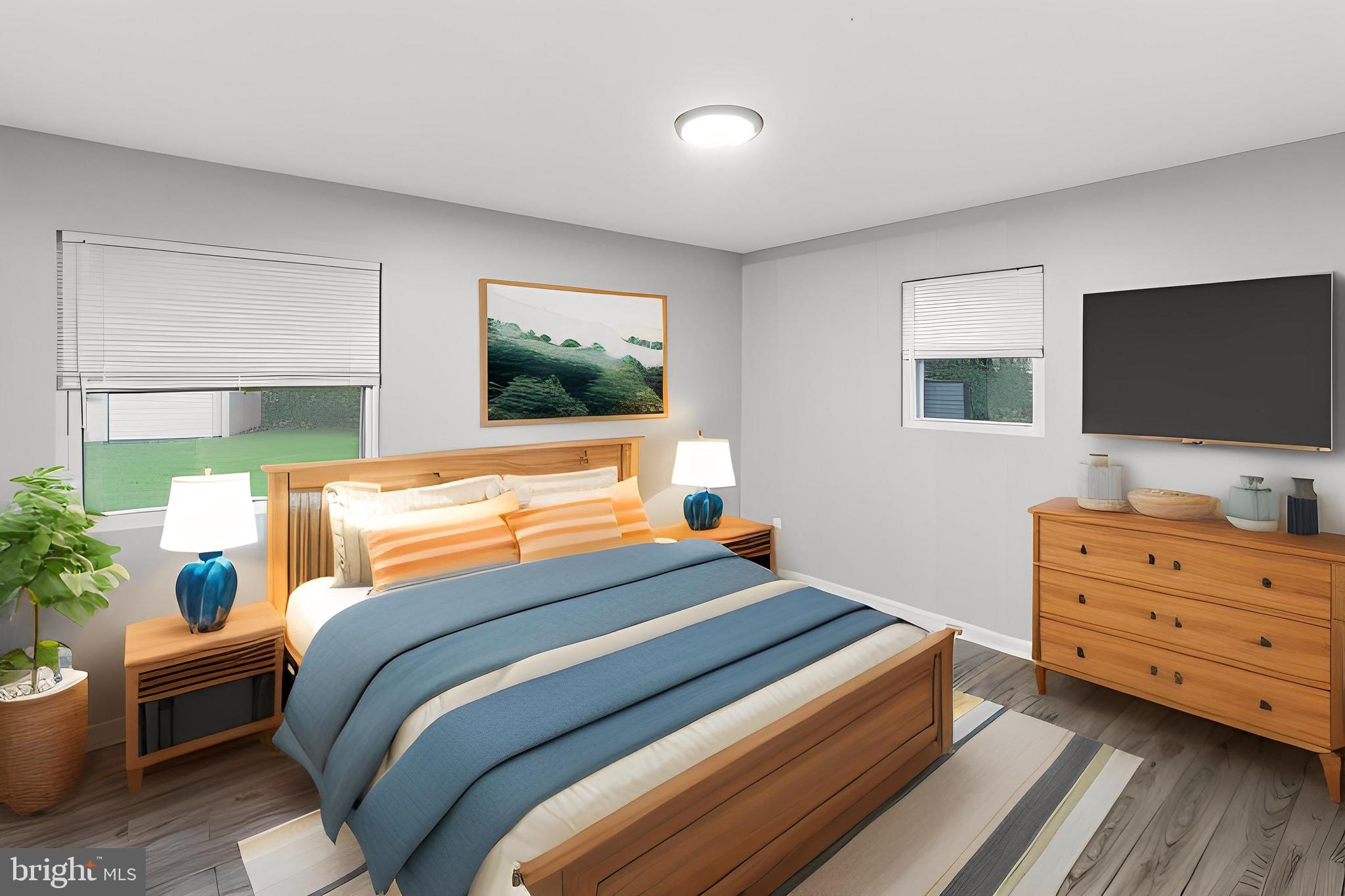 4 River Ridge Lane Fredericksburg, VA 22406 - Photo 26 of 43 a bedroom with a bed and a flat screen tv