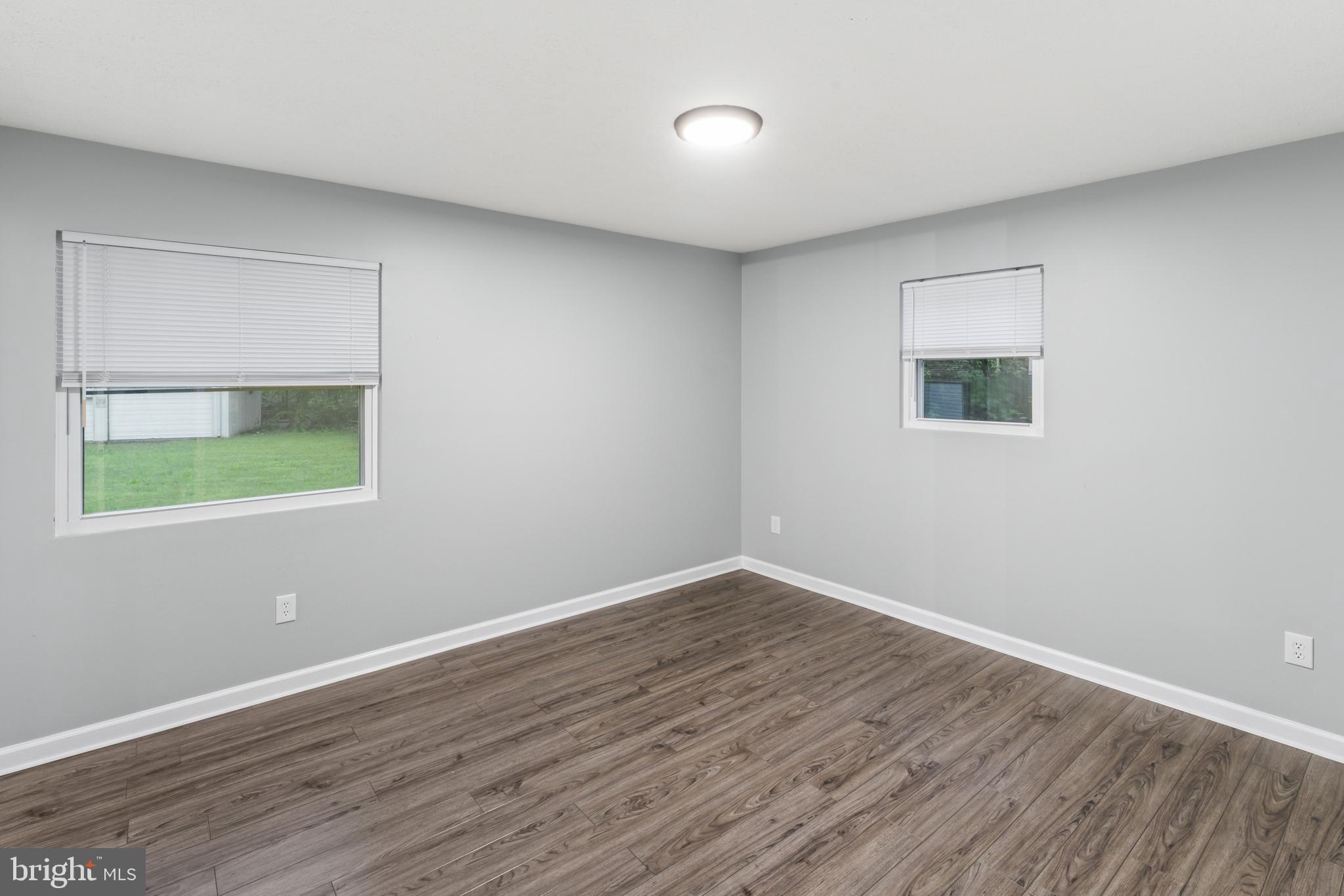 4 River Ridge Lane Fredericksburg, VA 22406 - Photo 27 of 43 a view of an empty room with wooden floor and a window