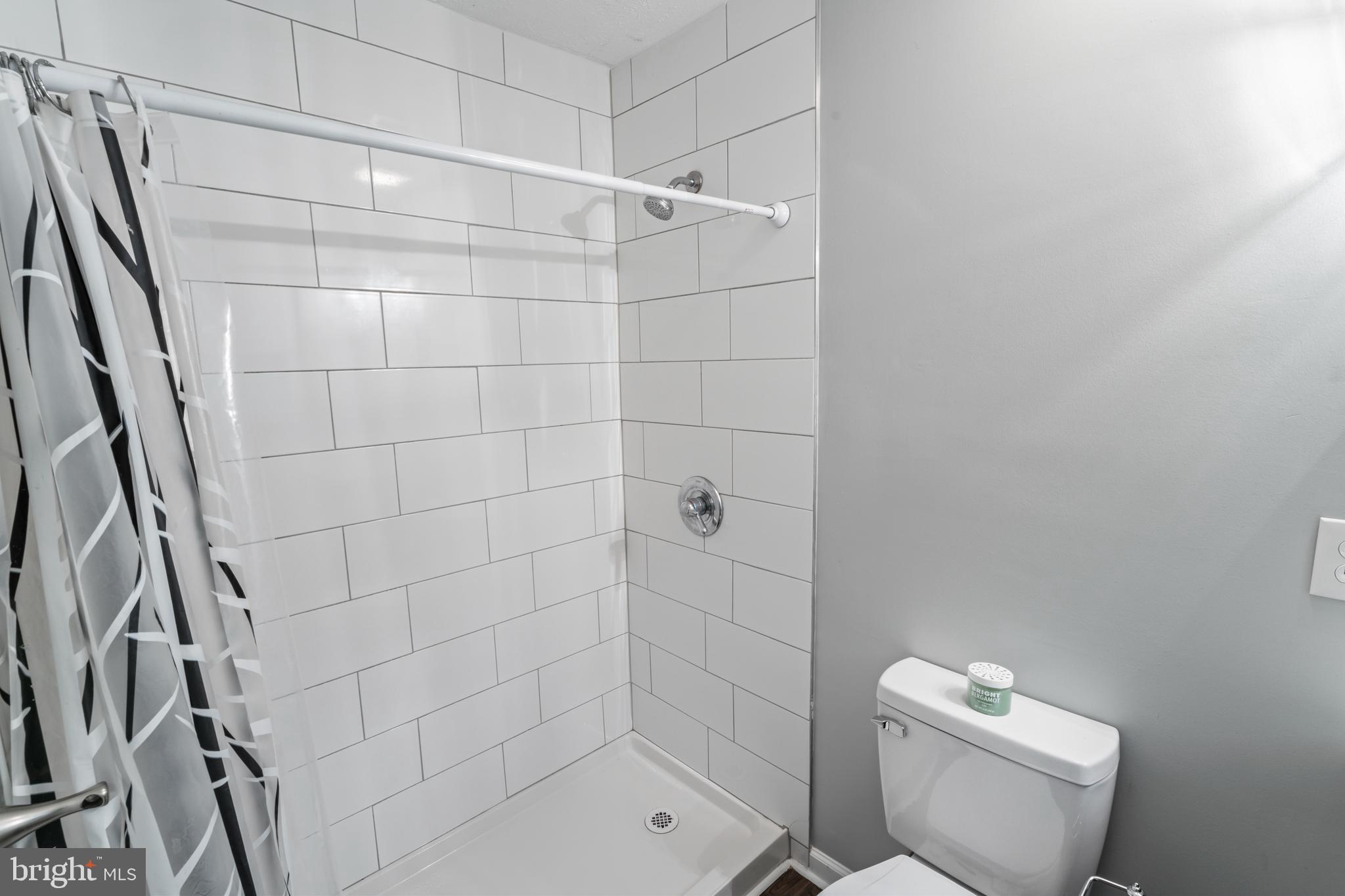 4 River Ridge Lane Fredericksburg, VA 22406 - Photo 28 of 43 a bathroom with a toilet and shower