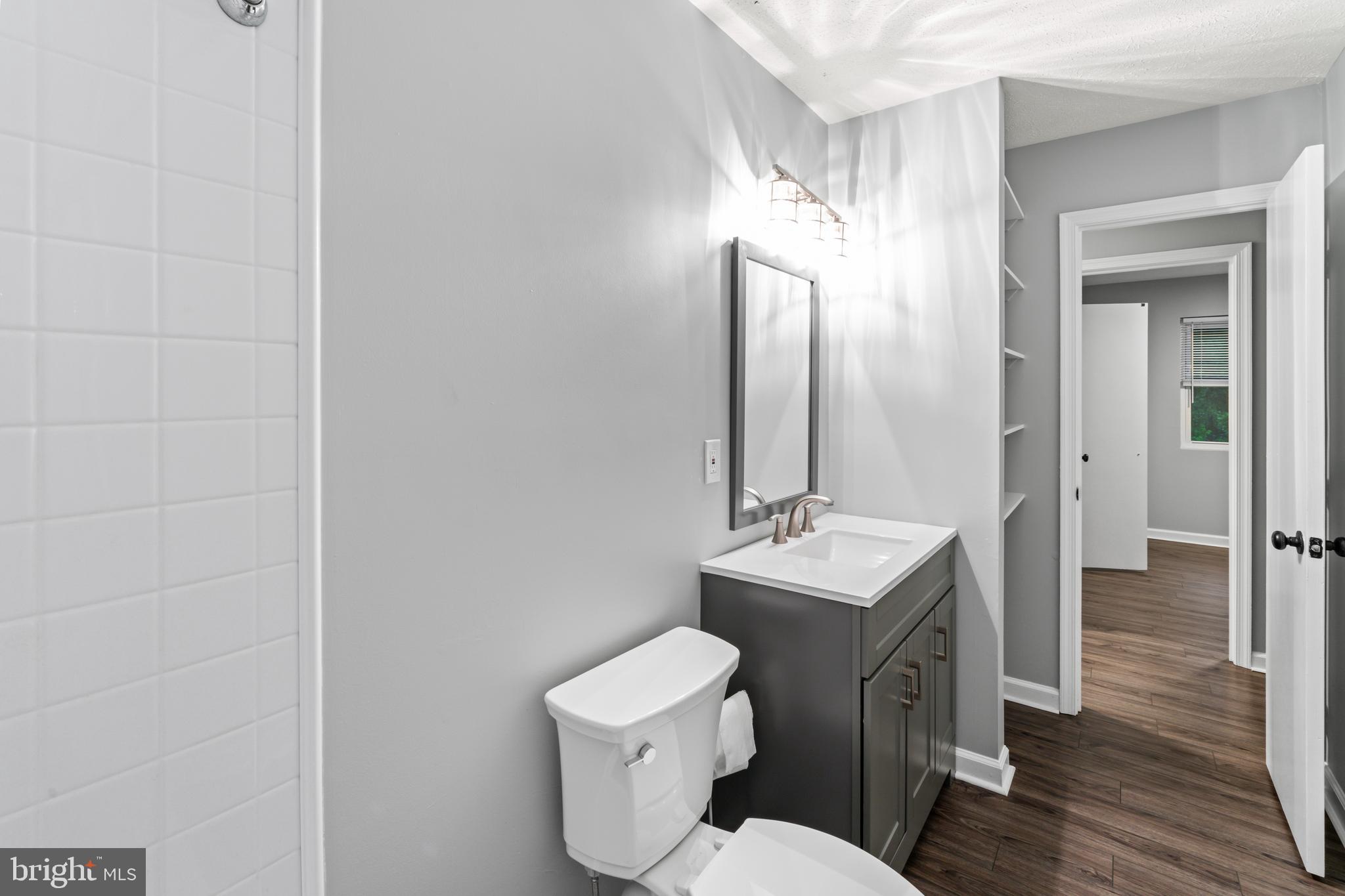 4 River Ridge Lane Fredericksburg, VA 22406 - Photo 31 of 43 a bathroom with a toilet a sink and mirror