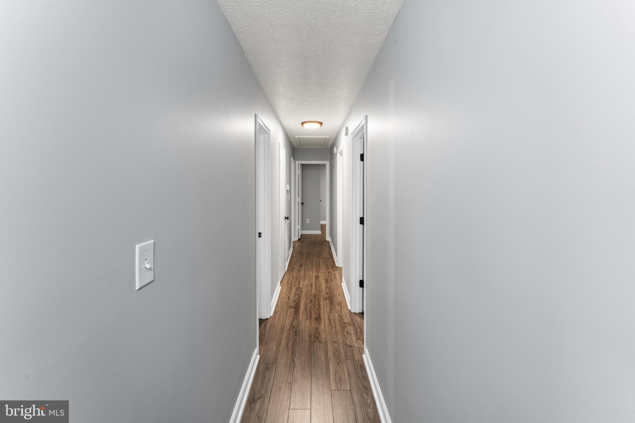 4 River Ridge Lane Fredericksburg, VA 22406 - Photo 32 of 43 a view of a hallway with wooden floor