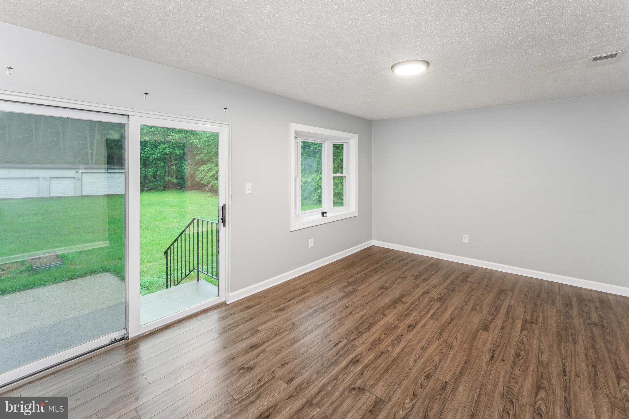 4 River Ridge Lane Fredericksburg, VA 22406 - Photo 33 of 43 a view of an empty room with wooden floor and a window