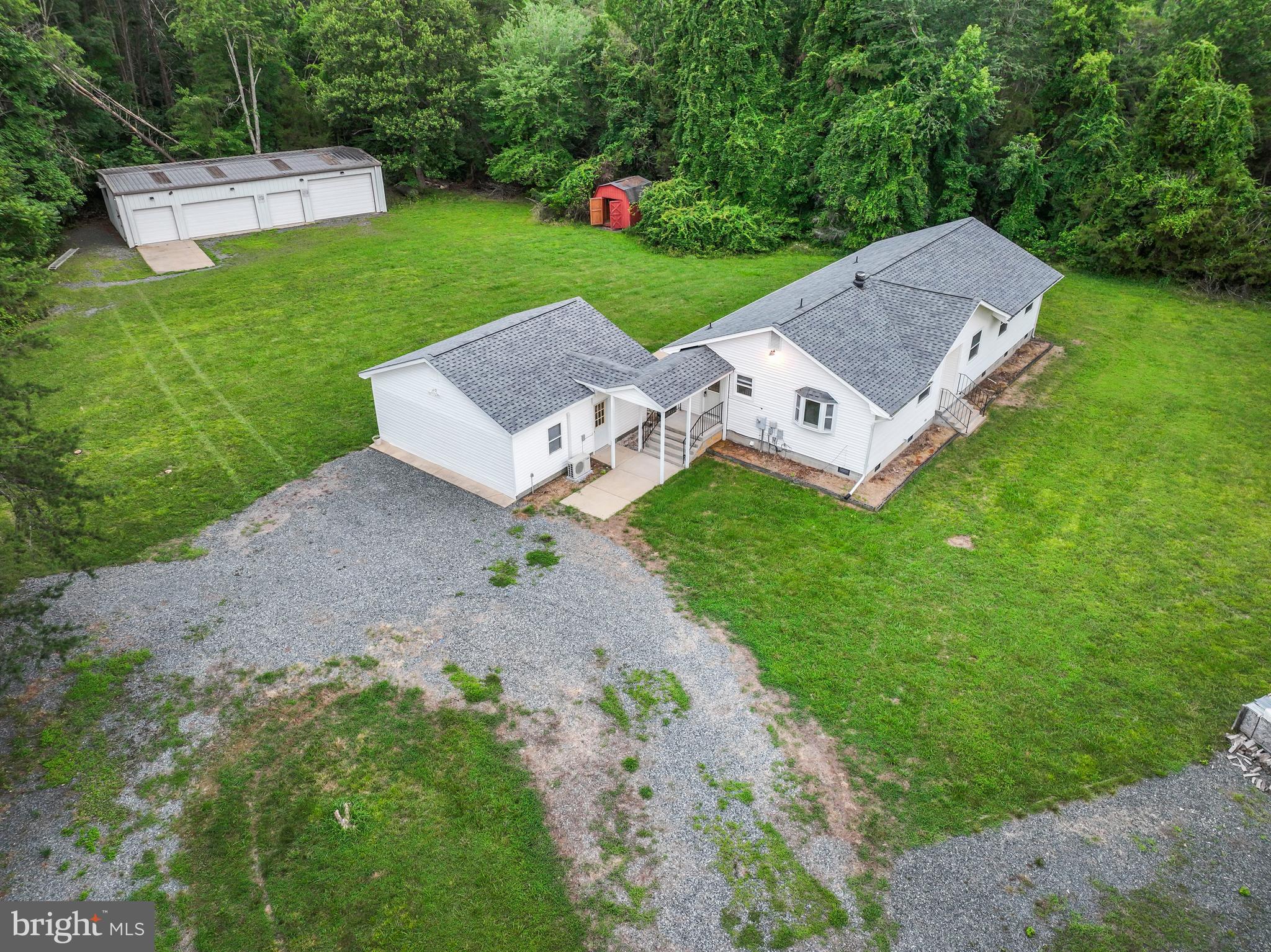 4 River Ridge Lane Fredericksburg, VA 22406 - Photo 38 of 43 a view of a house with a yard and a garden